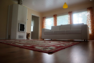 The apartment is located surrounded by a peaceful neighborhood and the outdoor area near Köykärimäki and approximate 2,5km from the Kokkola centre. In a living room there is a couch and fireplace.
